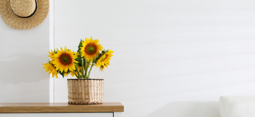 Beautiful,Yellow,Sunflowers,On,Chest,Of,Drawers,In,Room,,Space