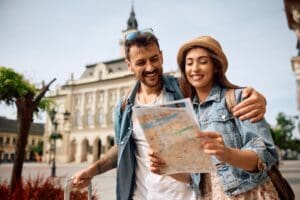Happy,Couple,Enjoying,In,Travel,While,Exploring,A,Map,During