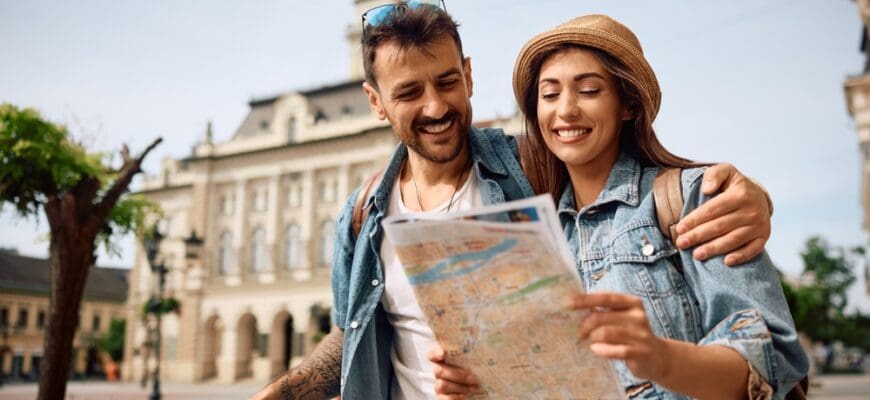 Happy,Couple,Enjoying,In,Travel,While,Exploring,A,Map,During