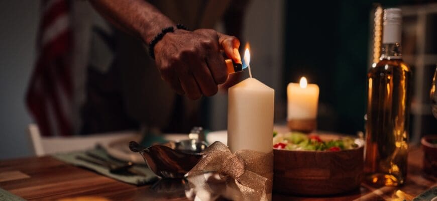 Chef,Lights,A,Candle,On,A,Table,Set,For,Dinner,